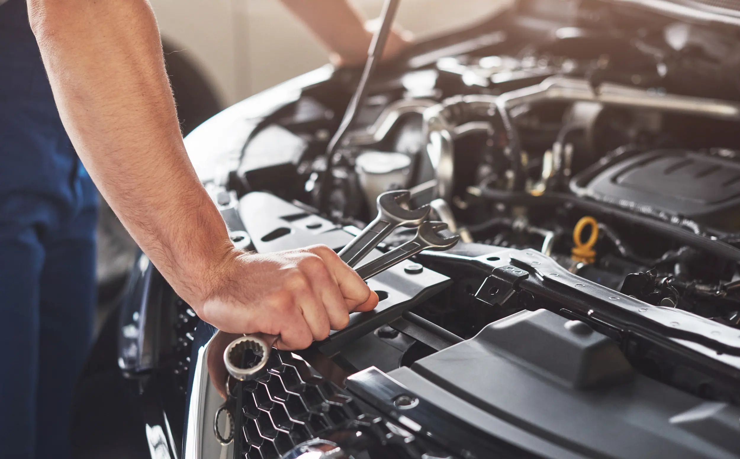 Automotive technicians working in a modern service center