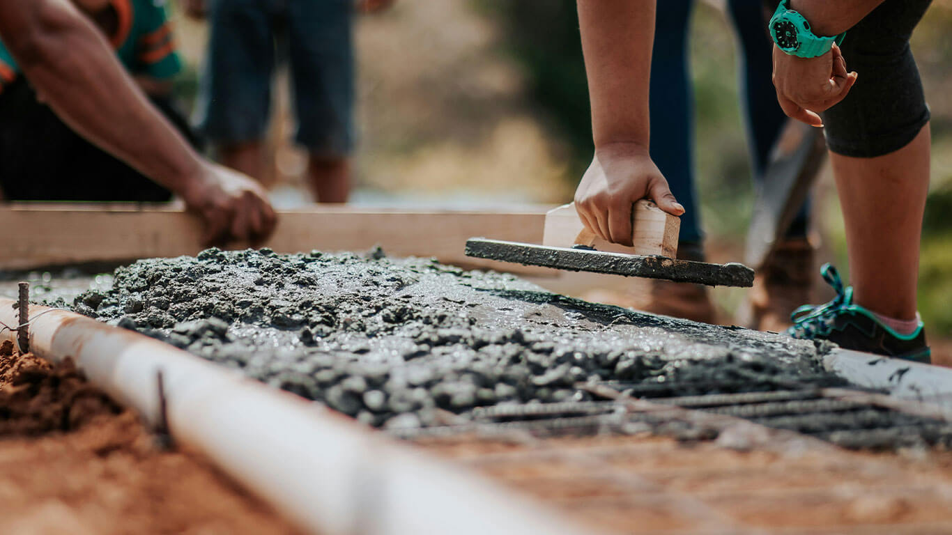 Construction workers collaborating on a high-rise building project